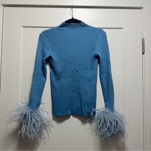 Pellobello : knit sweater with feather sleeves
